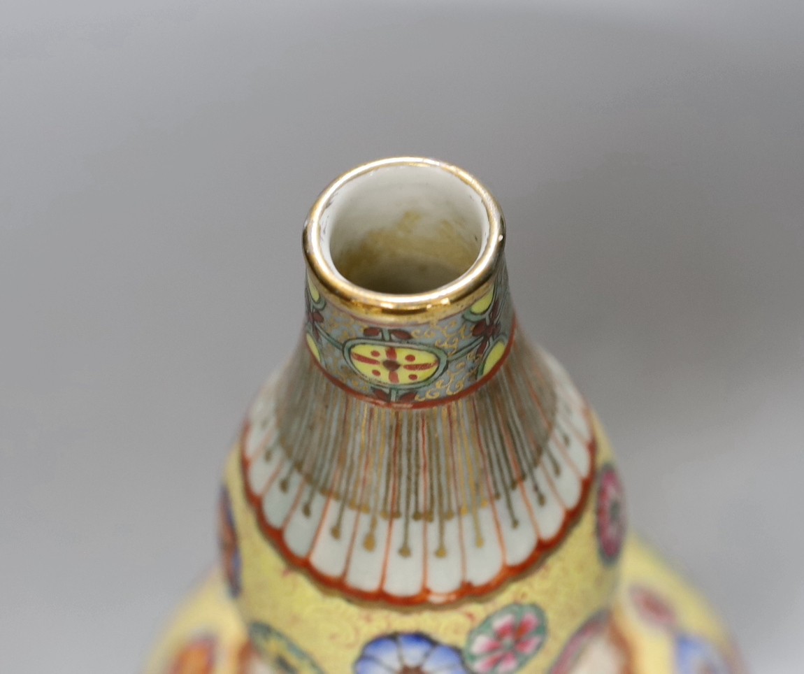 A Chinese enamelled porcelain double walled rotating vase, 24cm